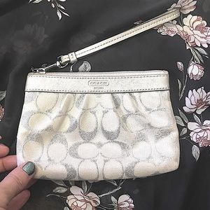 Gorgeous silver Coach wristlet good used condition
